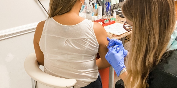 Person getting injection in arm